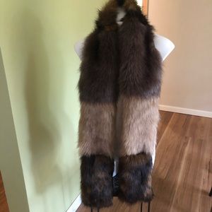 Faux fur wrap with pockets.